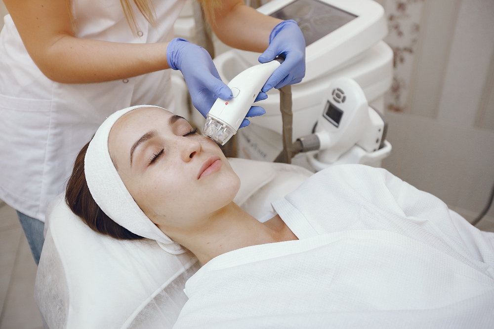 A woman undergoing a facial treatment with Advatx laser, showcasing advanced skin care in Omaha or La Vista.