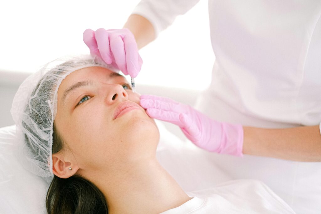 Woman undergoing eyebrow enhancement with Botox at Day Dream Spa, a leading dermatology specialist in Omaha, NE.