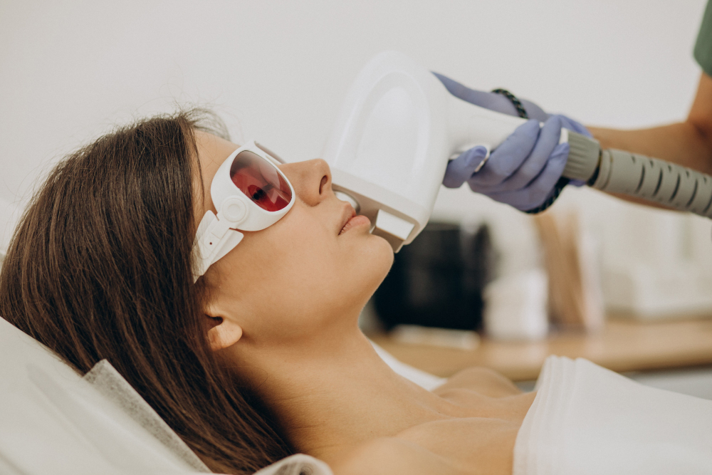 Woman receiving ADVATx laser treatment for effective scar removal in Omaha, highlighting precision and care in the procedure.