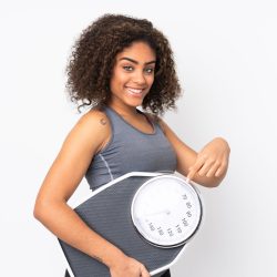 Young,African,American,Woman,Isolated,On,White,Background,Holding,A